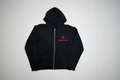 Black zip up jacket with starzshops logo on white table